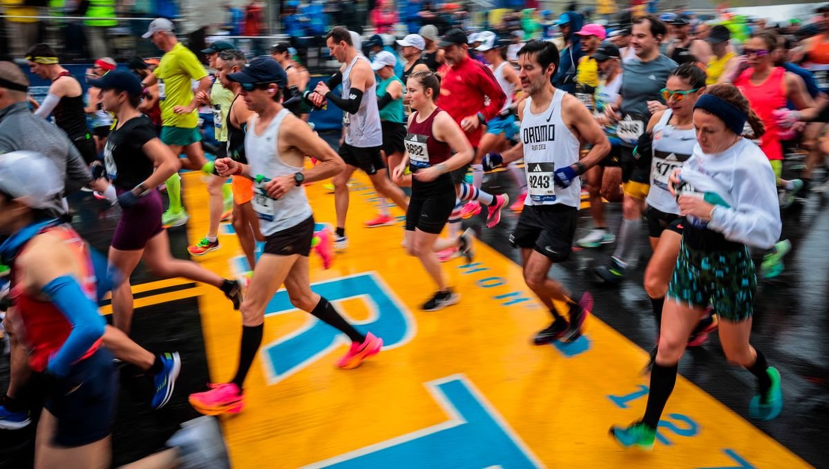 Runners cross the start line of the 2023 Boston Marathon