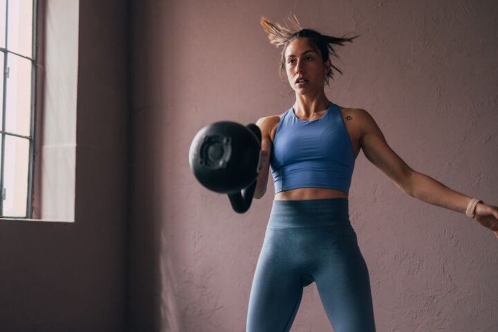 Woman exercises with kettlebell