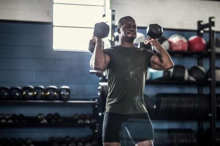 A man completing a CrossFit workout with dumbbells